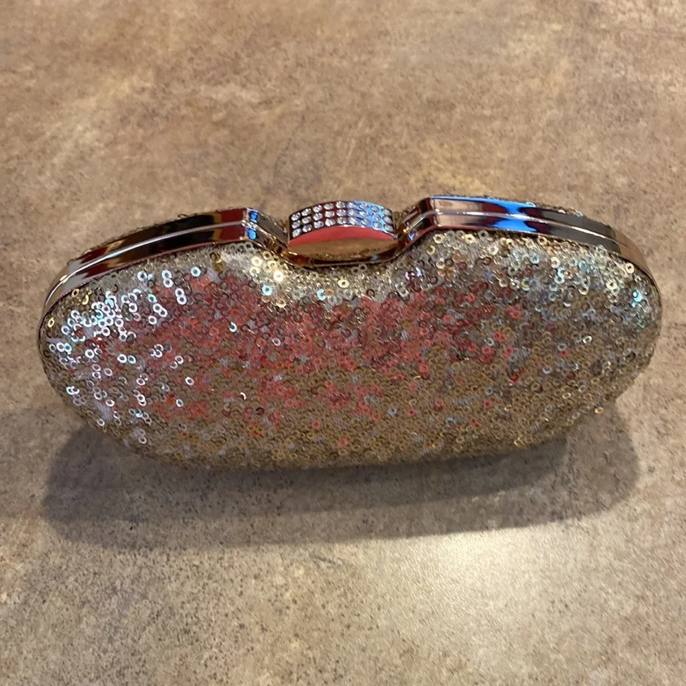 Womens gold clutch purse you can have the chain strap or tuck inside